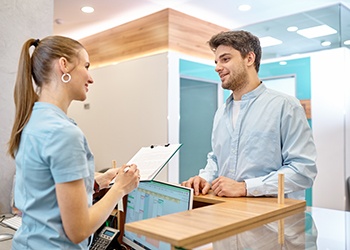 Dental patient discussing financing with office manager