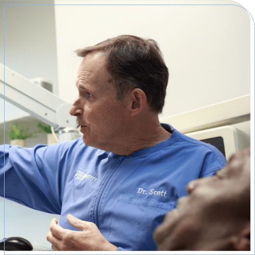 Doctor Scott talking to a dental patient