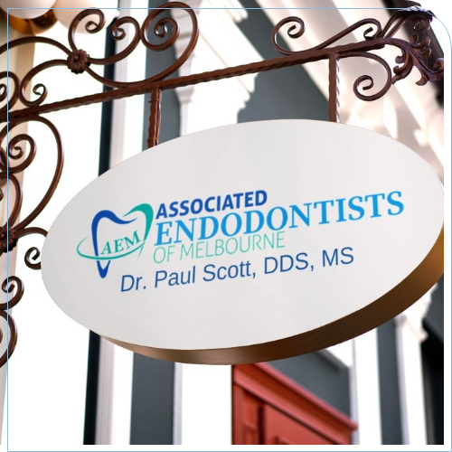 Sign on outside of dental office that reads Associated Endodontists of Melbourne Doctor Paul Scott D D S M S