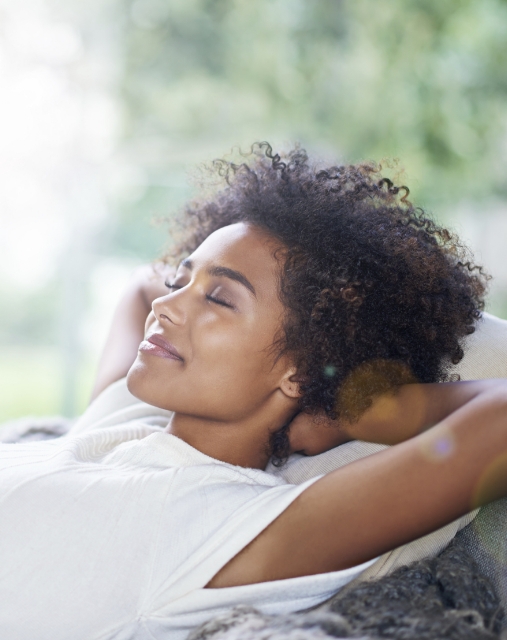 Woman laying down and relaxing after oral sedation dentistry in Melbourne