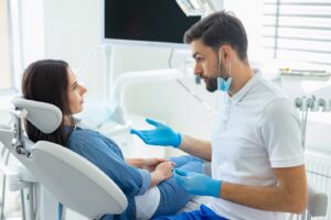Dentist and patient having a conversation.
